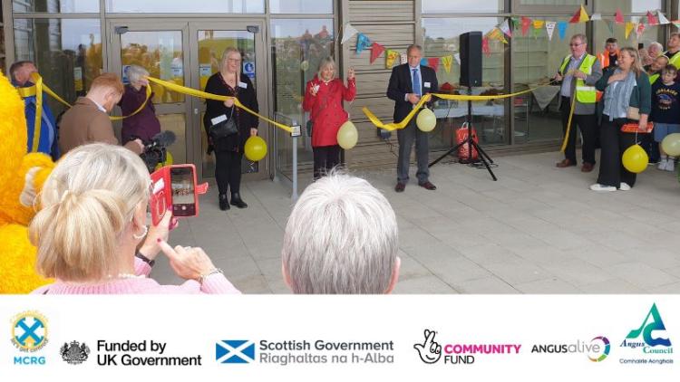 Ribbon being cut by Monfieth Community Resource Group at official opening of the new Monifieth Community Hub and Library