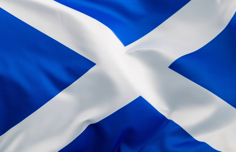 Scottish flag with blue background and white diagonal cross.