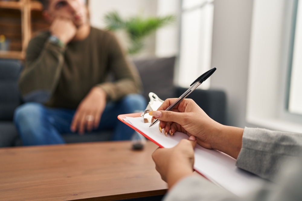 meeting with man and woman taking notes